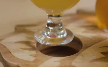 Stock Video Person Leaving A Beer Cup On A Wooden Board