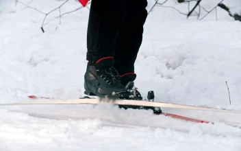 Stock Video Person On Snow Taking Off Skis