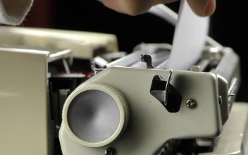 Video Stock Person Putting Paper On A Typewriter Free