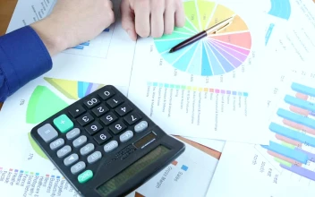 Video Stock Person Reviewing Graphs On Paper Free
