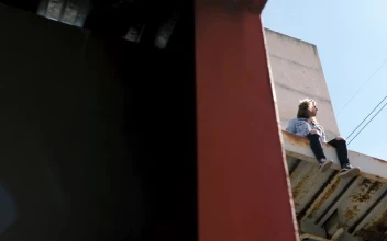 Video Stock Person Sits On Awning Of Abandoned Building Free