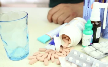 Video Stock Person Taking A Pill Among Other Drugs Free