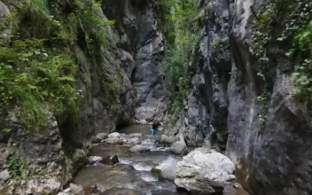 Video Stock Person Walking By A River In The Mountains Free