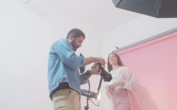 Video Stock Photographer And Model Reviewing Photos From A Shoot Free