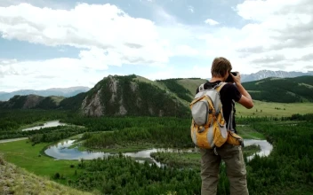 Video Stock Photographer Shooting From The Top Of A Mountain Free