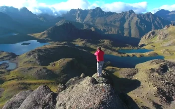 Video Stock Photographer Working At The Top Of A Mountain Peak Free