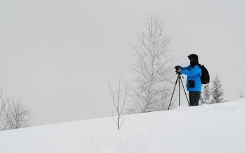 Video Stock Photographer Working While Snowing On The Mountain Free