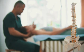 Video Stock Physiotherapist Working On A Womans Neck In Background Free