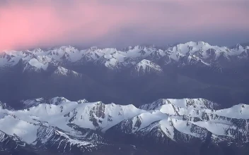 Video Stock Pink Clouds Over A Snowy Mountain Range Free