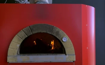 Video Stock Placing A Pizza In A Red Oven Free