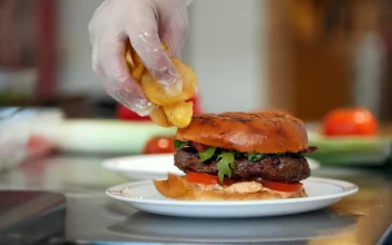 Video Stock Placing French Fries On A Plate With A Hamburger Free