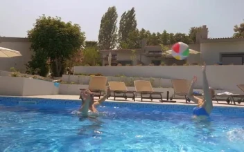 Video Stock Playing With A Large Ball In The Pool Free