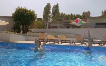 Video Stock Playing With A Large Ball In The Pool  Large Free