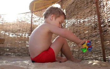Video Stock Playing With A Toy In The Sand Free