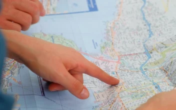 Video Stock Pointing To A Map Of A City With His Hands Free