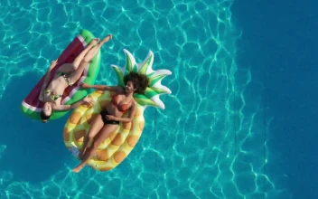 Video Stock Pool With Two Girls Lying On Floats Free