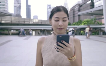 Video Stock Portrait Of A Woman Walking Who Uses Cell Phone Free