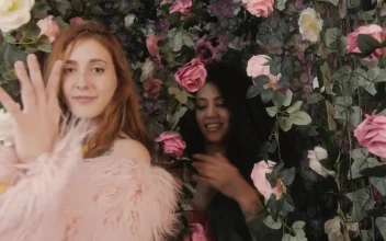 Video Stock Portrait Of Two Funny Girls Among Many Flowers Free