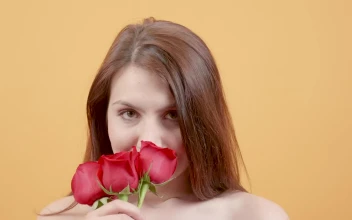 Video Stock Portrait Of Young Woman Smelling Red Roses Free