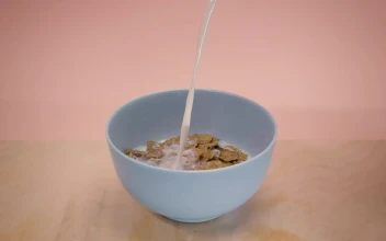Video Stock Pouring Milk Into A Bowl With Chocolate Flavored Cereal Free