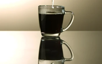 Video Stock Pouring Milk Into A Cup Of Coffee In Slow Motion Free