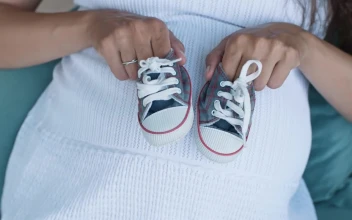 Video Stock Pregnant Woman Holding Small Baby Shoes Top Shot Free