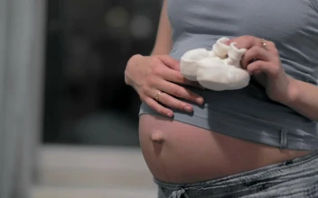 Video Stock Pregnant Woman Holding White Shoes Free