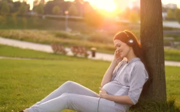 Video Stock Pregnant Woman Listening To Music In The Park Free
