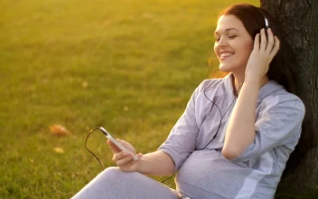 Video Stock Pregnant Woman Listening To Music On Her Cell Phone Free