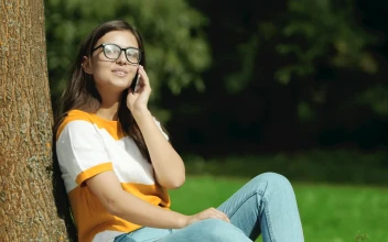 Video Stock Pretty Girl In Glasses Says Hello On Mobile In Park Free