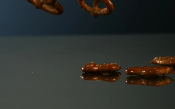Video Stock Pretzels Falling Into A Mirror Surface Free