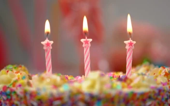 Video Stock Putting Out Candles On A Colorful Cake Free