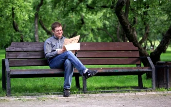 Video Stock Reading A Newspaper In The Park Free
