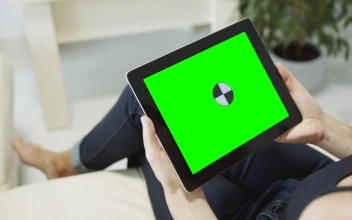 Free Stock Video Sitting On Sofa Browsing Web On Chroma Key Tablet