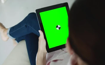 Free Stock Video Sitting Woman Holding Greenscreen Tablet With Chroma Key
