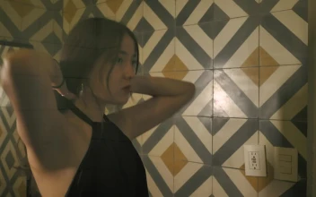 Free Stock Video Reflection In A Womans Mirror As She Ties Her Hair