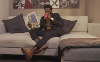 Free Stock Video Relaxed Guy Drinking Coffee While He Reads The News