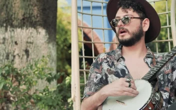 Free Stock Video Relaxed Man With Hat And Glasses Playing The Banjo In