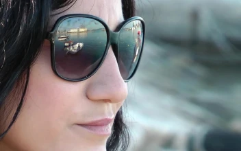 Free Stock Video Relaxed Woman Wearing Glasses By The Seashore