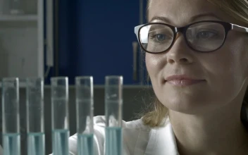 Free Stock Video Researcher Adding Blue Liquid To Test Tubes