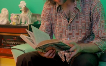 Free Stock Video Retro Man Sitting On Sofa Reading Book