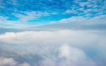 Free Stock Video Revealing A Snowy Mountain From The Cloudy Sky