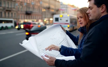 Free Stock Video Reviewing Building Plans In The Street