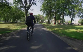 Free Stock Video Riding A Bike Through A City Park