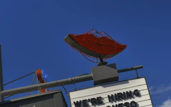 Free Stock Video Rotating Neon Sign Of Lips On Top Of A Business