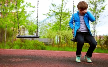 Free Stock Video Sad Lonely Boy Sitting On The Swings At The Playground