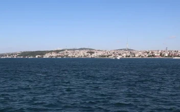 Free Stock Video Sailing The Sea Near The Shore Of A City