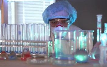 Free Stock Video Scientist Mixing Components On Flasks