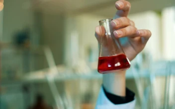 Free Stock Video Scientist Shaking A Conical Flask In The Laboratory