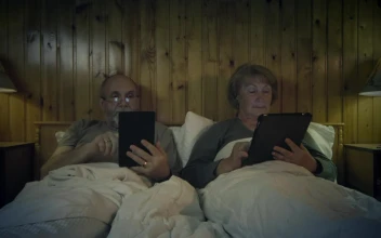 Free Stock Video Senior Couple Reading On The Bed With Devices